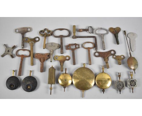 A Collection of Various Vintage Clock Keys and Pendulum 