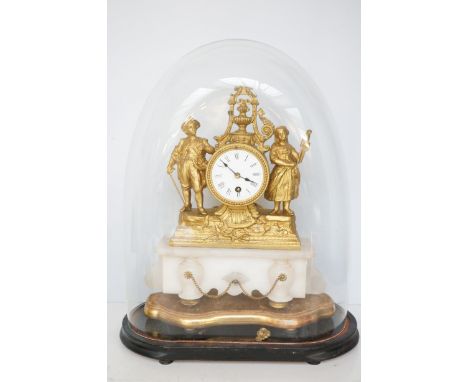 Gilt mantle clock in a glass dome, very minor repair to gilt Total height 50 cm 