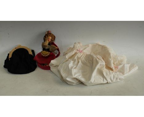 An early/mid 20th Century novelty handbag as a doll dressed in traditional outfit; another, black framed evening purse, eleph