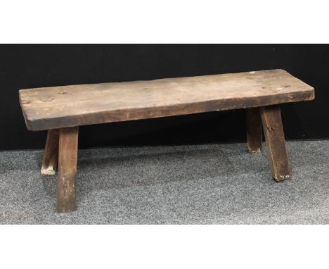 A 19th century elm pig bench