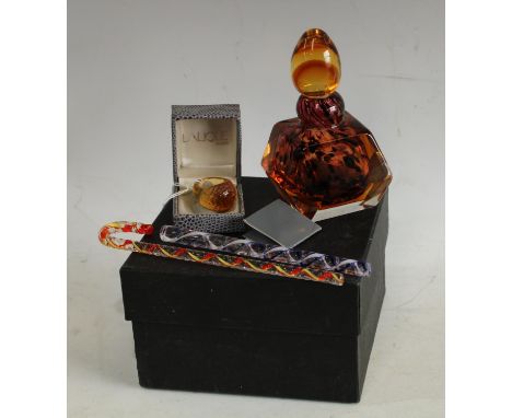 A Lalique Fleur de Lilas amber glass ring, boxed; a studio glass scent bottle and stopper, boxed; a miniature glass walking s