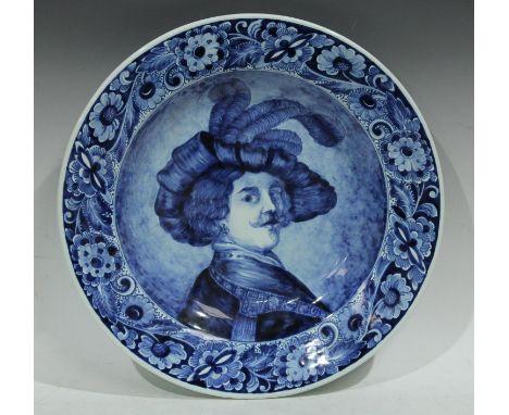 A Delft circular charger, painted in underglaze blue, after Rembrant van Rijn, self portrait, 42.5cm diam, marked