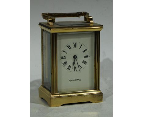 A Mappin &amp; Webb brass carriage clock, cream dial, Roman numerals, manual wind movement, folding handle, 14.5cm high