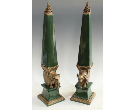 A pair of Jordan ceramic and spelter mounted decorative elephant obelisks, 63cm, printed mark