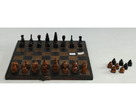 A WWII prisoner of war hand carved chess set in folding board/box