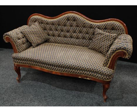 A Victorian style sofa, serpentine button back, scroll arms, serpentine seat, stuffed over upholstery, 184cm wide