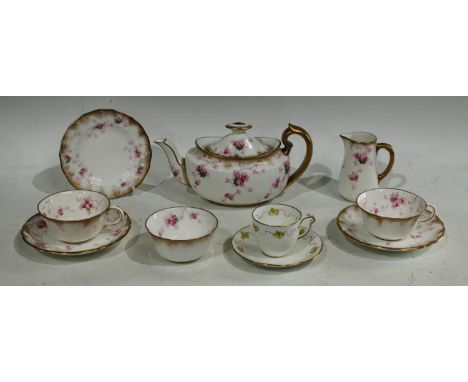 A Royal Crown Derby tete - a - tete comprising teapot, pair of cups and saucers, milk jug, sugar bowl and single side plate, 