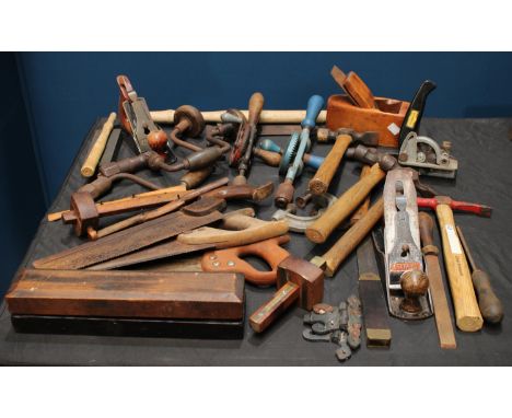 A quantity of vintage tools to include planes, hammers, sharpening stone, saws etc