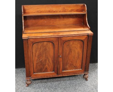 A 19th century mahogany chiffonier, of unusual proportions, the stepped superstructure with two shelves, the projecting base 