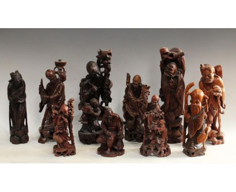 A carved wooden figure of a bearded Priest with dog, others , Elder lamp base;  man and child, street vendor, scroll bearer, 