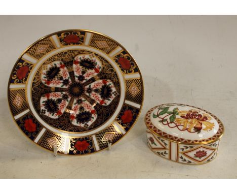 A Royal Crown Derby Honeysuckle pattern oval trinket pot and cover; an 1128 pattern saucer, both first quality Condition Repo