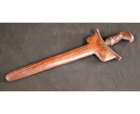 An Malay Indonesian kris, 23cm wavy blade, hardood stylised lotus handle, hardwood scabbard, 39cm long