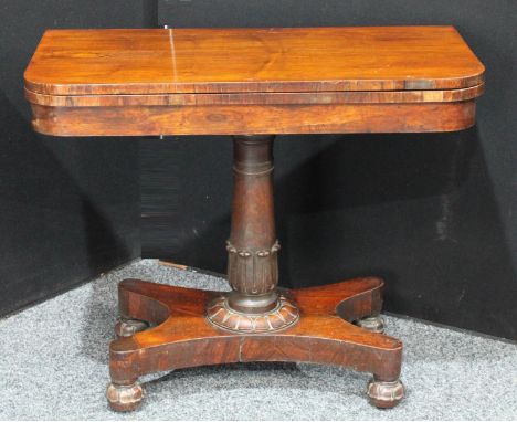 A William IV rosewood card table, hinged top enclosing an inset baize lined playing surface, spreading tulip grasped cylindri