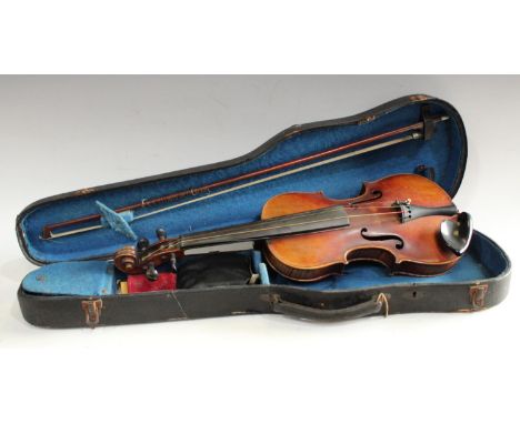 A late 19th/ early 20th century Stradivarius copy violin, two piece back, double line purfling, 35cm long, cased with unmarke