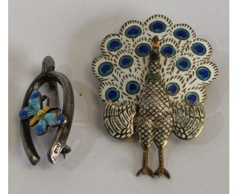 A silver and enamel wishbone butterfly brooch; another, as a peacock