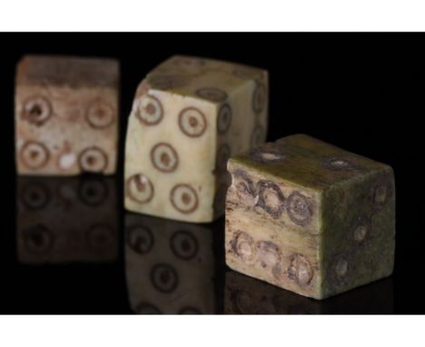 1-200 AD. Roman. A set of three bone dice with carefully carved dot-in-circle pips which are typical of dice of the Roman per