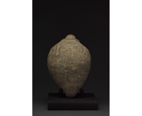 900-1200 AD, Byzantine. Decorated Byzantine "fire grenade" comprising a greyish vessel with a short neck nestled in a raised 