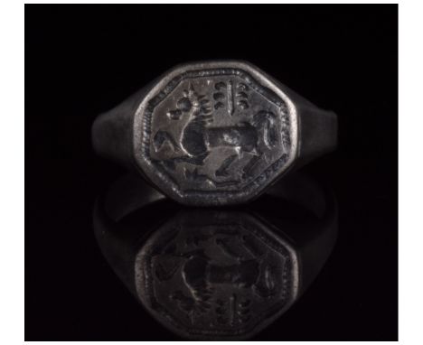 1-200 AD. Roman. Silver ring with D-shaped hoop and flattened, hexagonal bezel bearing an incised galloping horse motif. The 