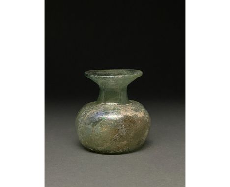 1-300 AD Roman. A beautiful light green jar comprising a rounded globular body, a short straight neck, and a wide flaring, ou