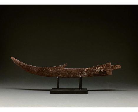 c. 1400 AD. medieval Persian. Iron sword or large dagger, with curved blade, protruding barb on the exterior and flaring tang