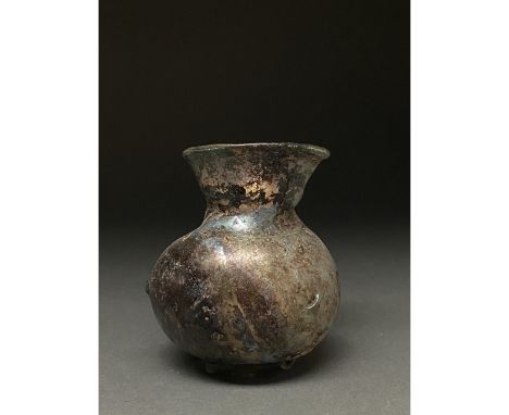 1-300 AD Roman. A beautiful light blue jar comprising a rounded globular body, a squat flaring neck, and a thin flexed rim. G