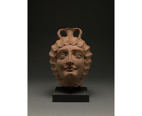 C. 193-211. Roman. This beautiful head pot features a woman’s face comprising high arching brows, upturned, almond shaped eye