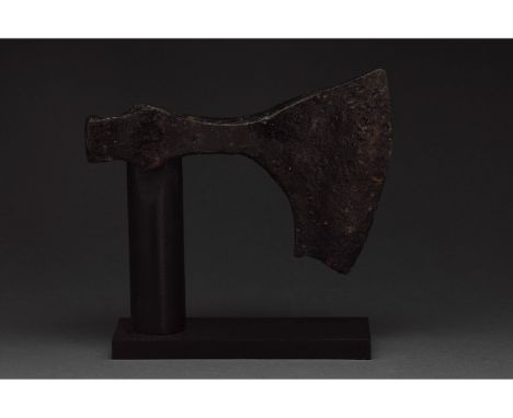 c. 900-1100 AD. Viking age. An iron bearded axe head with a, heavy blade, a lentoid shoulder and a round socket. The bearded 