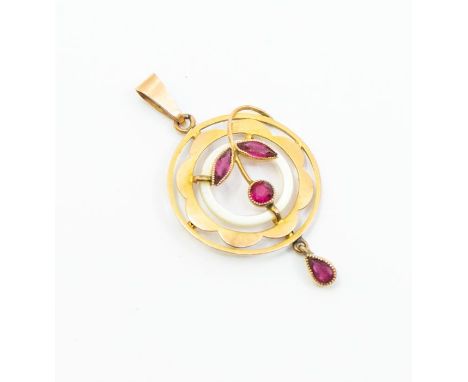 An Edwardian paste and mother of pearl 9ct gold mounted pendant, circular form with floral central motif, pear shaped dropper