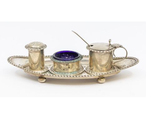 A Georgian style silver condiment set on stand, the lozenge shaped stand with gadroon border, three graduating recesses to bo