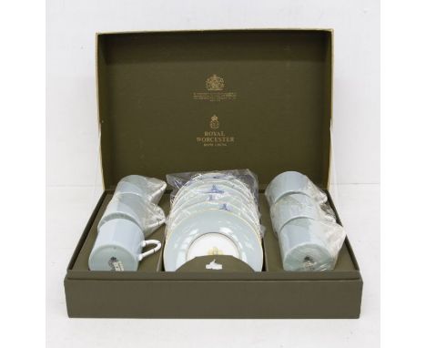 A Royal Worcester boxed Woodland six piece coffee set, unused, with bamboo style handles
