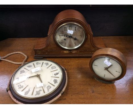 A 1930's inlaid mantle clock, a 1950's mantle clock, and a 1980's wall clock