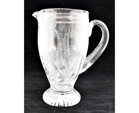 Three late 19th / early 20th Century cut glass pieces to include a large water jug, decorated with fern leaves; a quatrefoil 