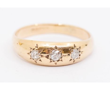 A diamond three stone 9ct gold ring, comprising three star set diamonds, size R, total gross weight approx 2.4gms Further det