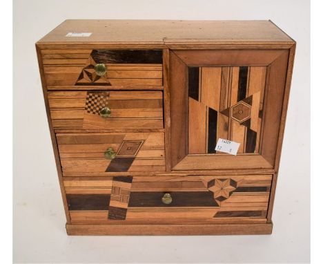 A 20th Century mahogany inlaid trinket box, small brass handles, four front drawers with two hidden behind lift up panel