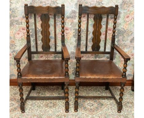 A pair of 19th century oak open armchairs, bobbin supports, leather seats, h-stretchers&nbsp;