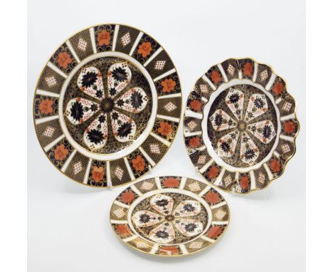 Three Royal Crown Derby plates in the 1128 Imari pattern, all first qualityCR; large plate has slight hairline crack