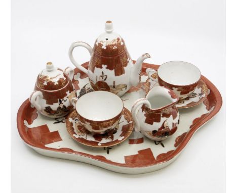 An early 20th Century Japanese tea for two service with ceramic serving tray