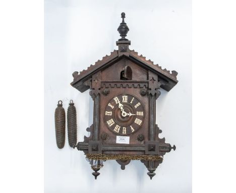 A good Black Forest cuckoo clock. Late Victorian. Two train brass movement. Chiming on a gong. 5 inch dial, nice and original