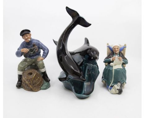 Two Royal Doulton figures; The Lobster Man, Twilight, along with Poole Pottery dolphin