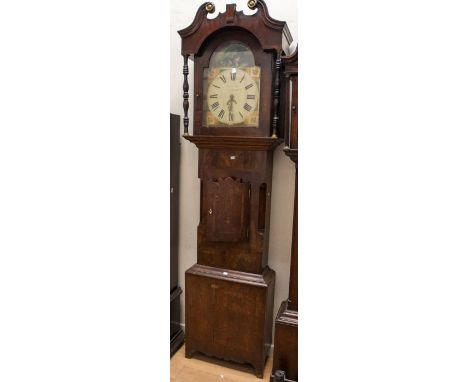 A late Victorian longcase clock by Richard Bridge. 13" arch dial with a scene of a child and dog in the arch. Contained in an