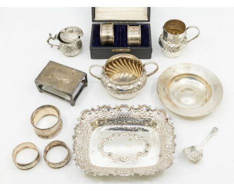 A collection of mainly early 20th Century silver to include: rectangular ornate dressing table dish; small milk jug and match