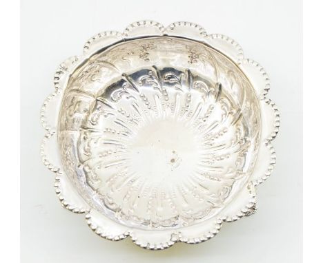 A Victorian silver sugar bowl, beaded floral border above wyvern fluted body, embossed floral decoration, on three lion's hea