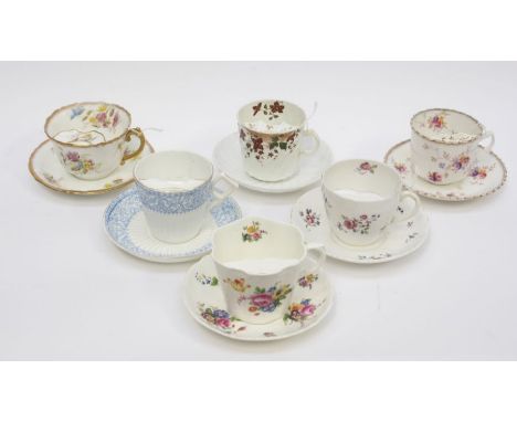 A collection of six early 20th Century Staffordshire moustache cup and saucers to include: Shelley pattern no: 8703 decorated