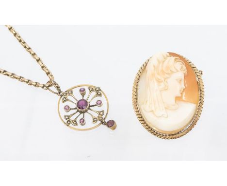 An Edwardian garnet and seed pearl  9ct gold open work pendant with central round cut garnet within wire, gold, garnet and se