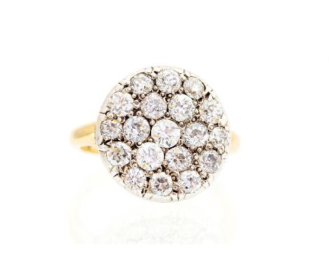 A diamond pave-set round cluster ring, the pave set flat round head comprising a total of nineteen round brilliant-cut diamon