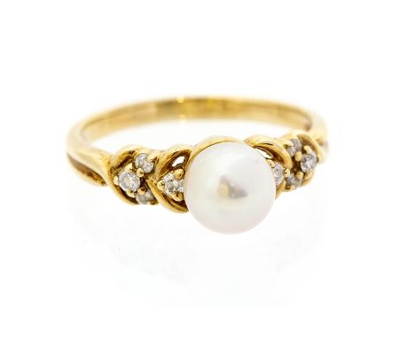 A pearl and diamond 9ct gold ring, the round cultured pearl set to the centre, measuring approx. 7.4mm, pink/green overtone, 