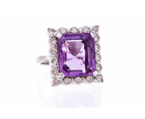 An amethyst and diamond 18ct gold square ring, comprising a square cut amethyst with a brilliant cut diamond set border, the 