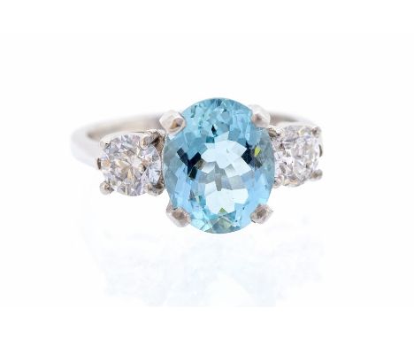 An aquamarine and diamond platinum set ring, the oval aquamarine set to the centre measuring approx. 10.91mm x 8.85mm x 5.65m