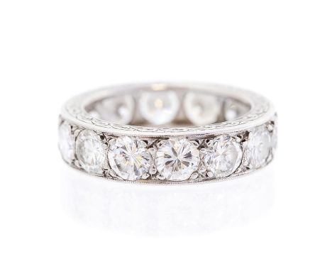 A diamond full set eternity platinum band ring, fourteen round brilliant-cut diamonds flush-grain set, total diamond weight a