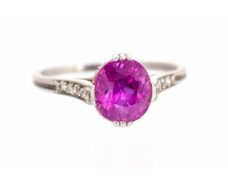 An Art Deco ruby single-stone ring with diamond set shoulders and mount, the oval mixed-cut ruby approx 8.5mm x 7.3mm, note v